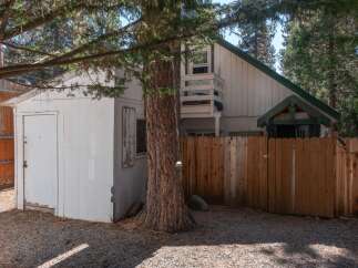 Discover this charming property featuring a detached garage and a fenced backyard, perfect for outdoor enjoyment.