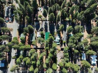 Discover this charming property nestled amongst mature pine trees, offering a serene and private atmosphere.