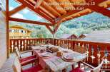 Enjoy al fresco dining on this charming wooden balcony, perfect for savoring meals with a view.
