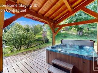 Experience ultimate relaxation with this luxurious hot tub, perfectly situated on a wooden deck under a charming covered patio.