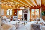 Experience the charm of this beautifully staged living room, featuring a cozy fireplace and ample natural light.