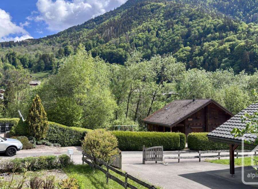 Nestled amidst lush greenery and rolling hills, this charming property offers a serene mountain retreat.