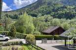Nestled amidst lush greenery and rolling hills, this charming property offers a serene mountain retreat.