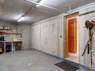 This property features a spacious and functional garage, perfect for storing vehicles and outdoor equipment.