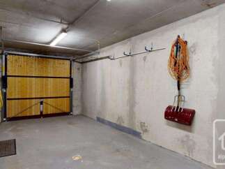 This spacious garage offers ample storage and convenience for your vehicles and outdoor equipment.