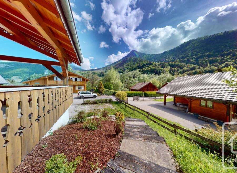 Experience the charm of alpine living in this picturesque property nestled amidst breathtaking mountain scenery.