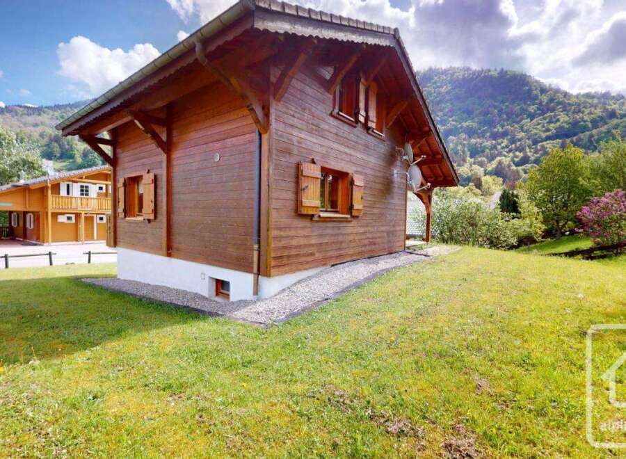 Nestled in a serene mountain landscape, this charming wooden chalet offers a picturesque retreat.