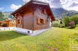 Nestled in a serene mountain landscape, this charming wooden chalet offers a picturesque retreat.