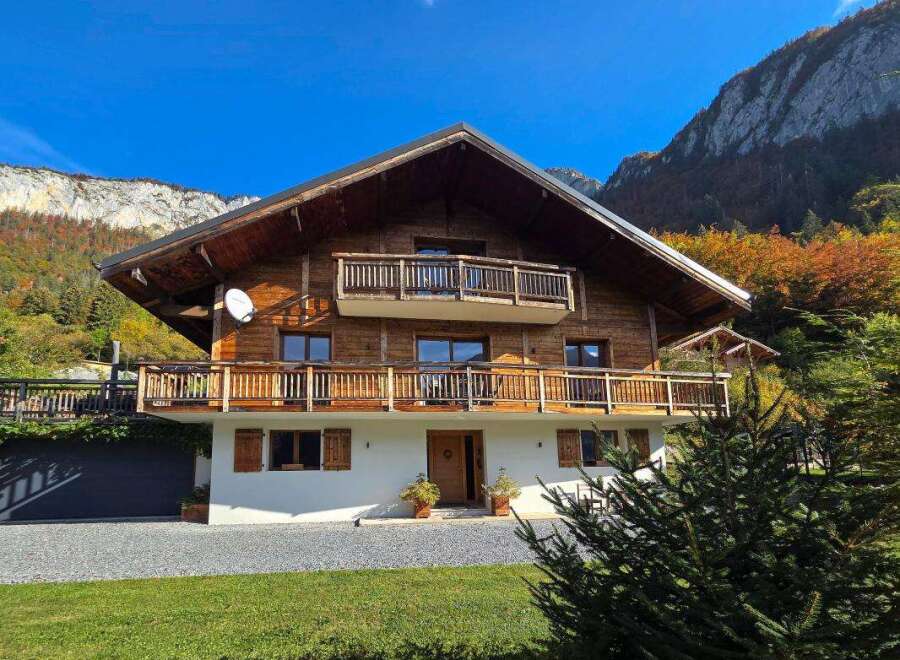 Experience the charm of this stunning wooden chalet nestled amidst breathtaking mountain scenery.