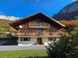 Experience the charm of this stunning wooden chalet nestled amidst breathtaking mountain scenery.