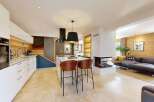Experience modern living in this stunning open-plan kitchen and living area.