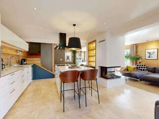 Experience modern living in this stunning open-plan kitchen and living area.