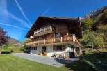 Experience the charm of this stunning wooden chalet nestled in a picturesque mountain setting.