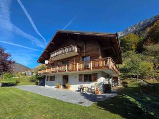 Experience the charm of this stunning wooden chalet nestled in a picturesque mountain setting.