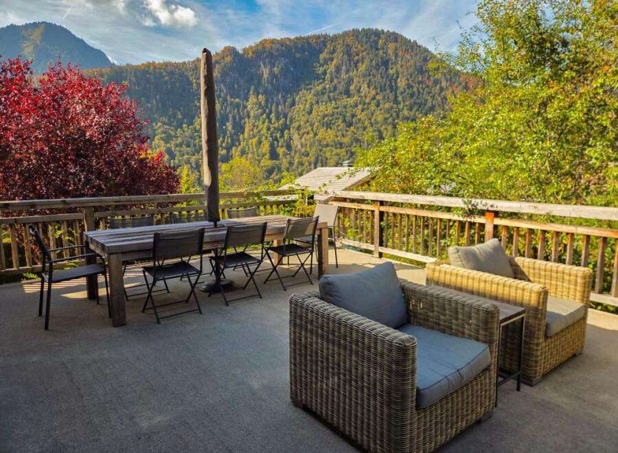 Enjoy breathtaking mountain views from this spacious outdoor patio, perfect for al fresco dining or relaxing with a book.