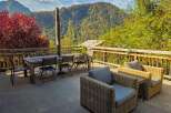Enjoy breathtaking mountain views from this spacious outdoor patio, perfect for al fresco dining or relaxing with a book.