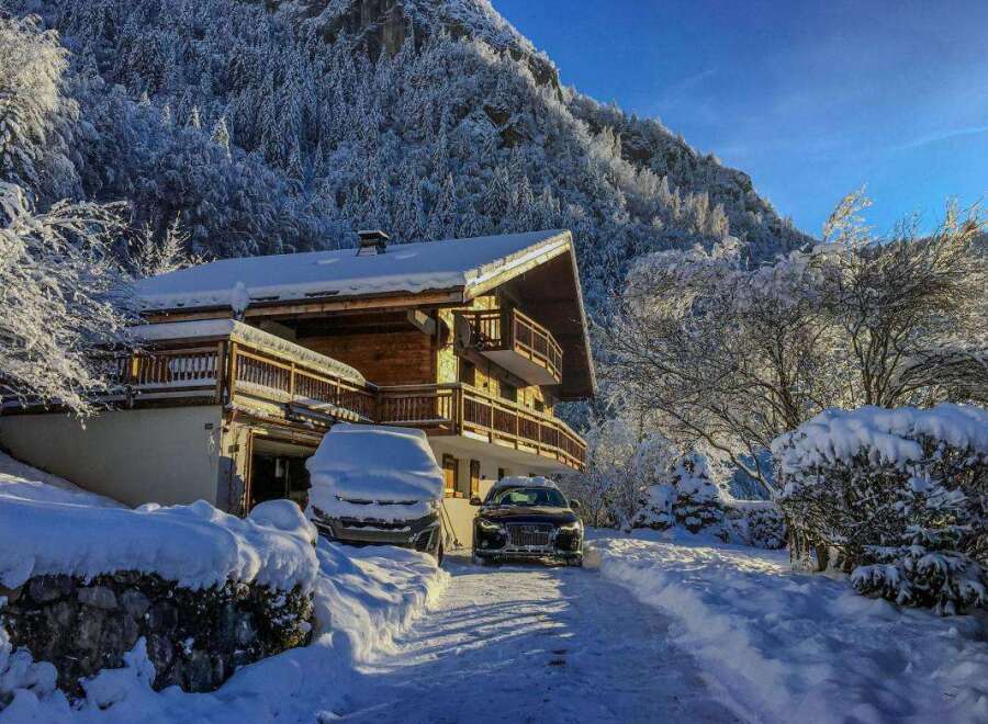 Experience the ultimate winter wonderland in this stunning chalet, nestled against a majestic snow-covered mountain.