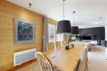 Experience rustic charm and modern comfort in this inviting dining area.