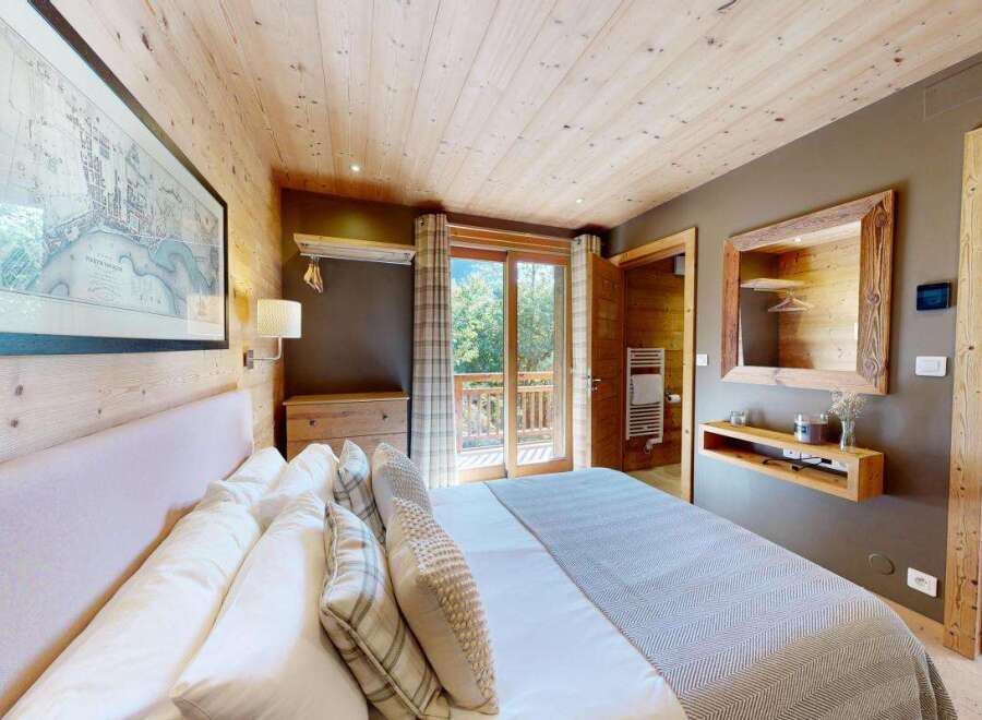 Experience rustic charm and modern comfort in this beautifully appointed bedroom.