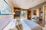 Experience rustic charm and modern comfort in this beautifully appointed bedroom.