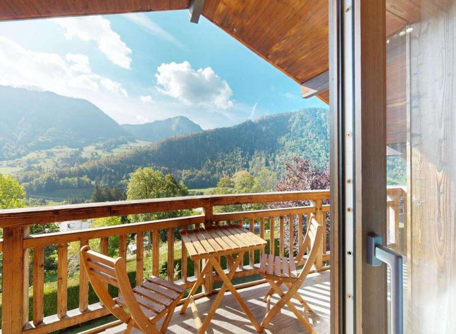 Enjoy breathtaking mountain views from this charming balcony, perfect for morning coffee or evening relaxation.