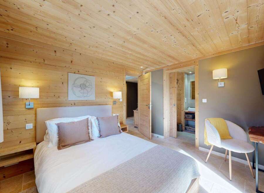 Experience rustic charm and modern comfort in this beautifully appointed bedroom.