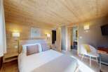 Experience rustic charm and modern comfort in this beautifully appointed bedroom.