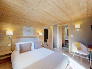 Experience rustic charm and modern comfort in this beautifully appointed bedroom.