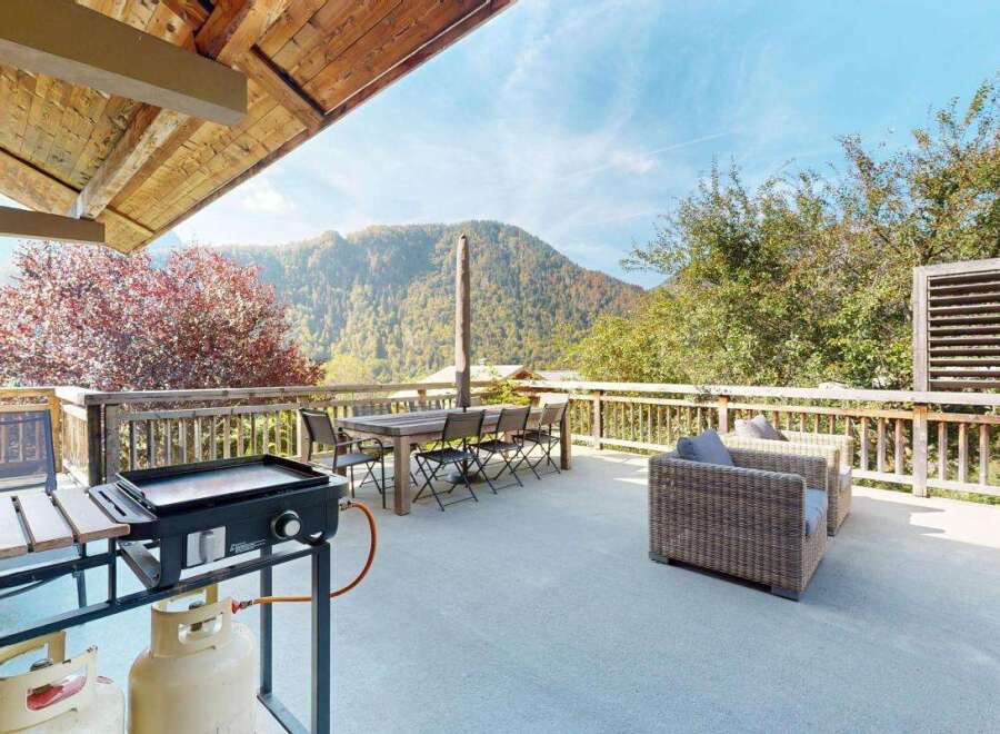 Enjoy breathtaking mountain views from this spacious deck, perfect for outdoor entertaining.