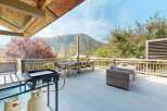 Enjoy breathtaking mountain views from this spacious deck, perfect for outdoor entertaining.