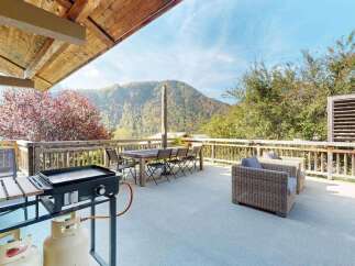 Enjoy breathtaking mountain views from this spacious deck, perfect for outdoor entertaining.