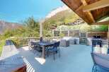 Enjoy breathtaking mountain views from this spacious outdoor living area, perfect for entertaining.