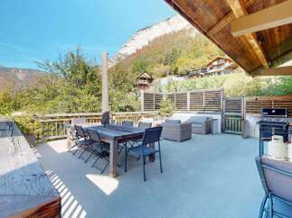 Enjoy breathtaking mountain views from this spacious outdoor living area, perfect for entertaining.