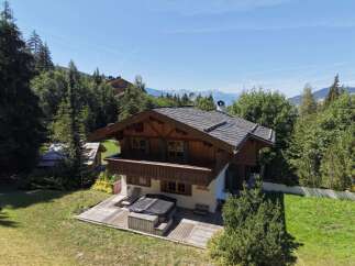 Experience luxury mountain living in this stunning chalet, nestled amidst lush greenery with breathtaking mountain views.