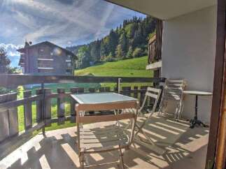 Enjoy breathtaking mountain views from this charming balcony, perfect for your morning coffee or evening relaxation.