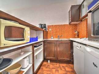 This compact kitchen features a convenient LG microwave oven, perfect for quick meals and reheating.