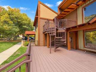Experience outdoor living at its finest on this expansive deck, perfect for entertaining or simply relaxing.