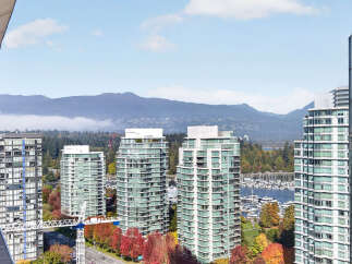 Experience luxury living with stunning panoramic views of the mountains and marina from this exquisite property.