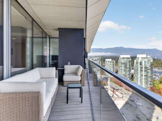 Enjoy breathtaking city and mountain views from this expansive balcony, perfect for entertaining or relaxing.