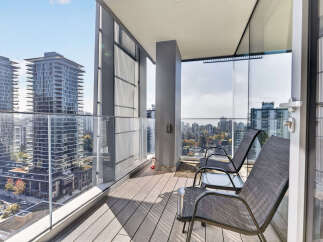 Experience breathtaking city views from this modern balcony, perfect for enjoying your morning coffee or evening relaxation.