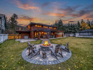 Experience the ultimate in outdoor living with this stunning backyard oasis, perfect for entertaining or relaxing evenings.