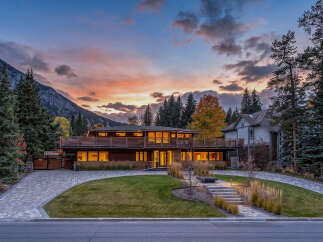 Experience luxury living in this stunning mountain modern home, perfectly situated against a backdrop of majestic peaks.