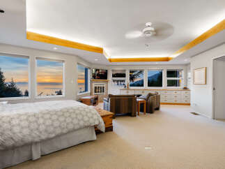 Experience breathtaking ocean and mountain views from this luxurious master suite.
