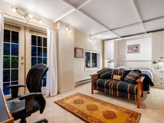 This versatile room features a comfortable sofa and a murphy bed, perfect for accommodating guests or maximizing space.