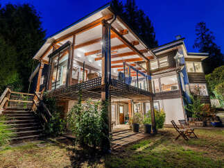 Experience luxurious living in this stunning multi-level home, featuring expansive decks and large windows that invite natural light.