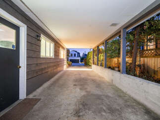 This property features a spacious covered carport, perfect for protecting your vehicles from the elements.