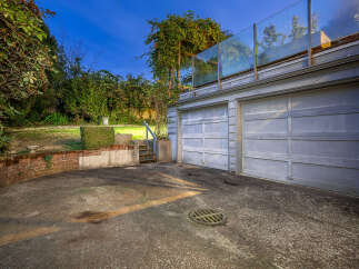 Discover this charming property featuring a spacious two-car garage, perfect for vehicle storage or a workshop.