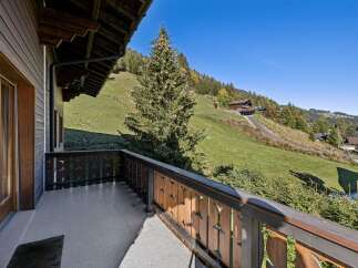 Enjoy breathtaking mountain views from this charming balcony, perfect for your morning coffee or evening relaxation.