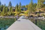 Enjoy the serene lakefront lifestyle with this stunning property featuring a private dock and crystal-clear waters perfect for swimming and water sports.