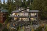 This multi-level home offers stunning views from its expansive decks, perfect for outdoor entertaining.